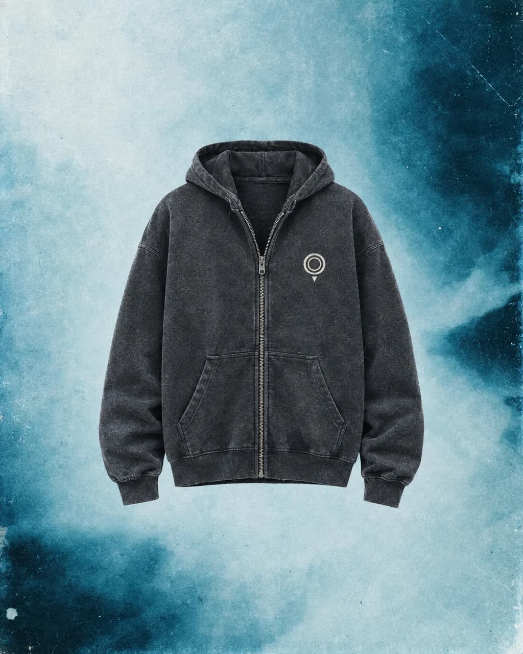Charcoal zip hoodie with the nested-ring map-pin logo on an ice-blue wash