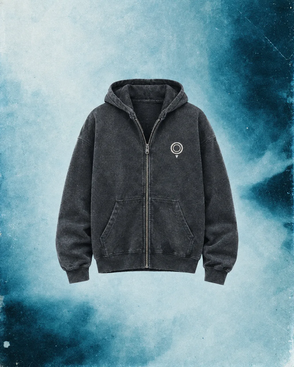 Charcoal zip hoodie with the nested-ring map-pin logo on an ice-blue wash